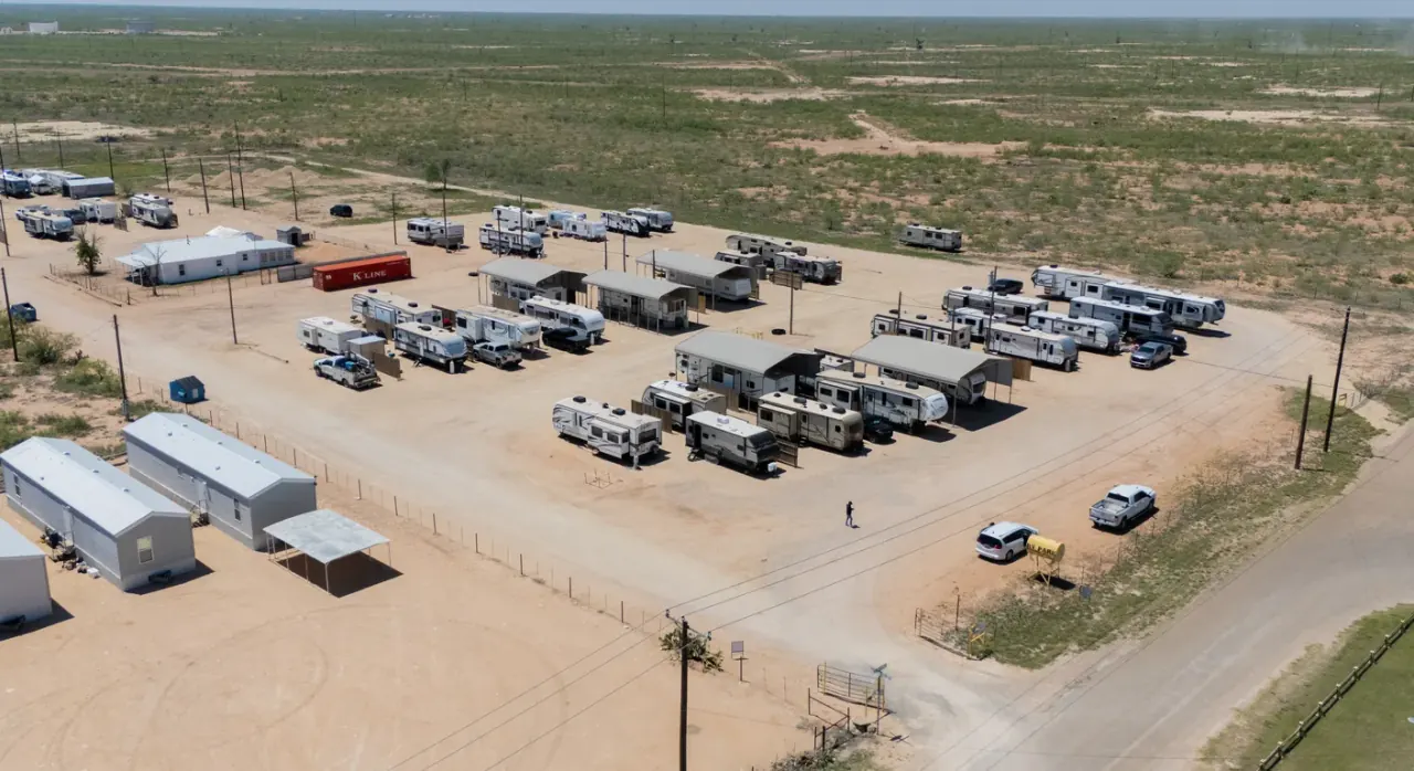Aerial view of Goldsmith RV Park & Housing with RV sites, carports and housing units in Goldsmith, TX